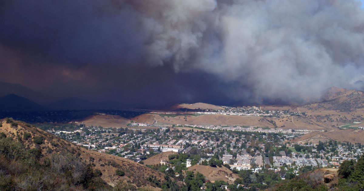 Suburban area with wildfire smoke approaching