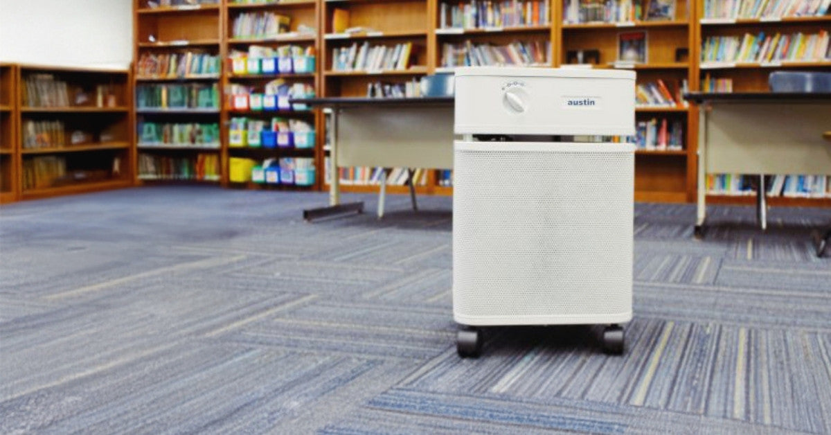 A white Austin Air Purifier in a school library