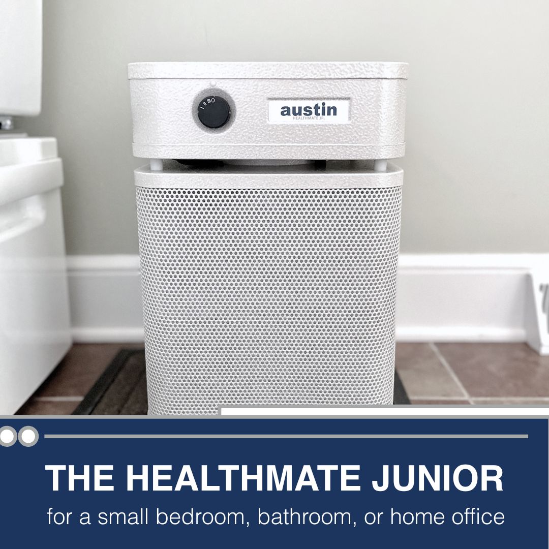White air purifier labeled 'austin' in a bathroom setting with text about its use.
