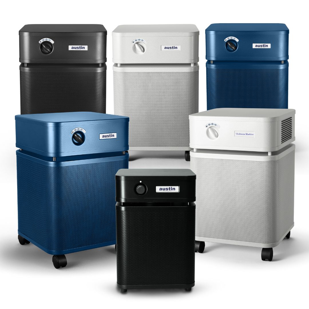 Collection of Austin air purifiers in various colors on a white background
