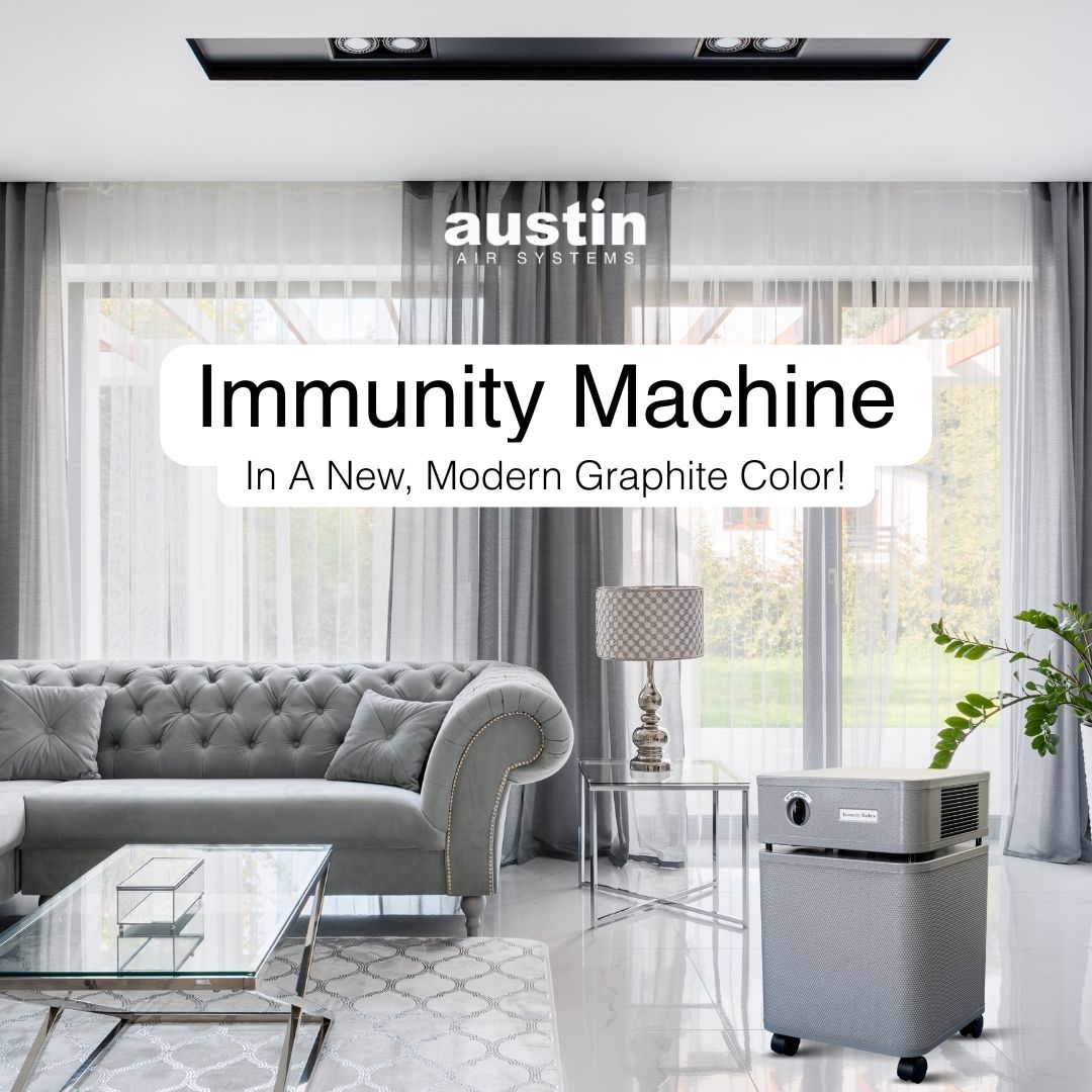 Modern living room with a gray air purifier labeled 'austin air systems' and text about an 'Immunity Machine'.