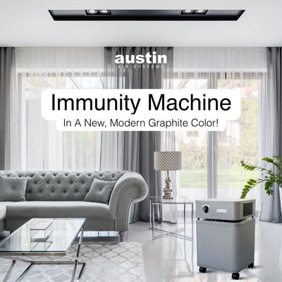 Modern living room with a gray air purifier labeled 'austin air systems' and text about an 'Immunity Machine'.